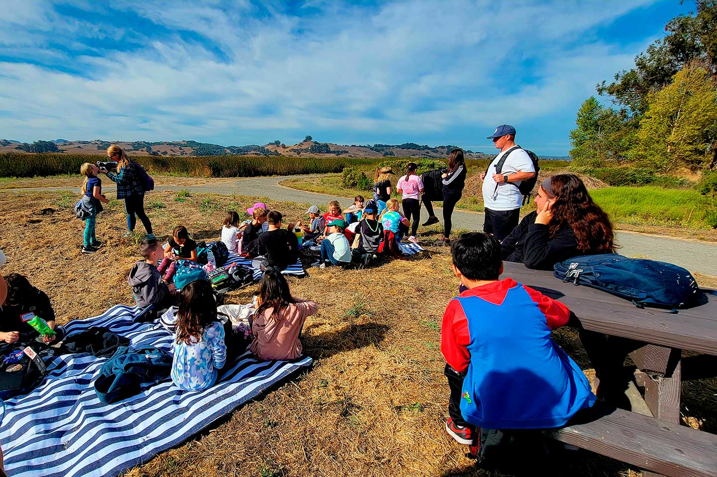 A group of young students gathered in Shollenberger park.